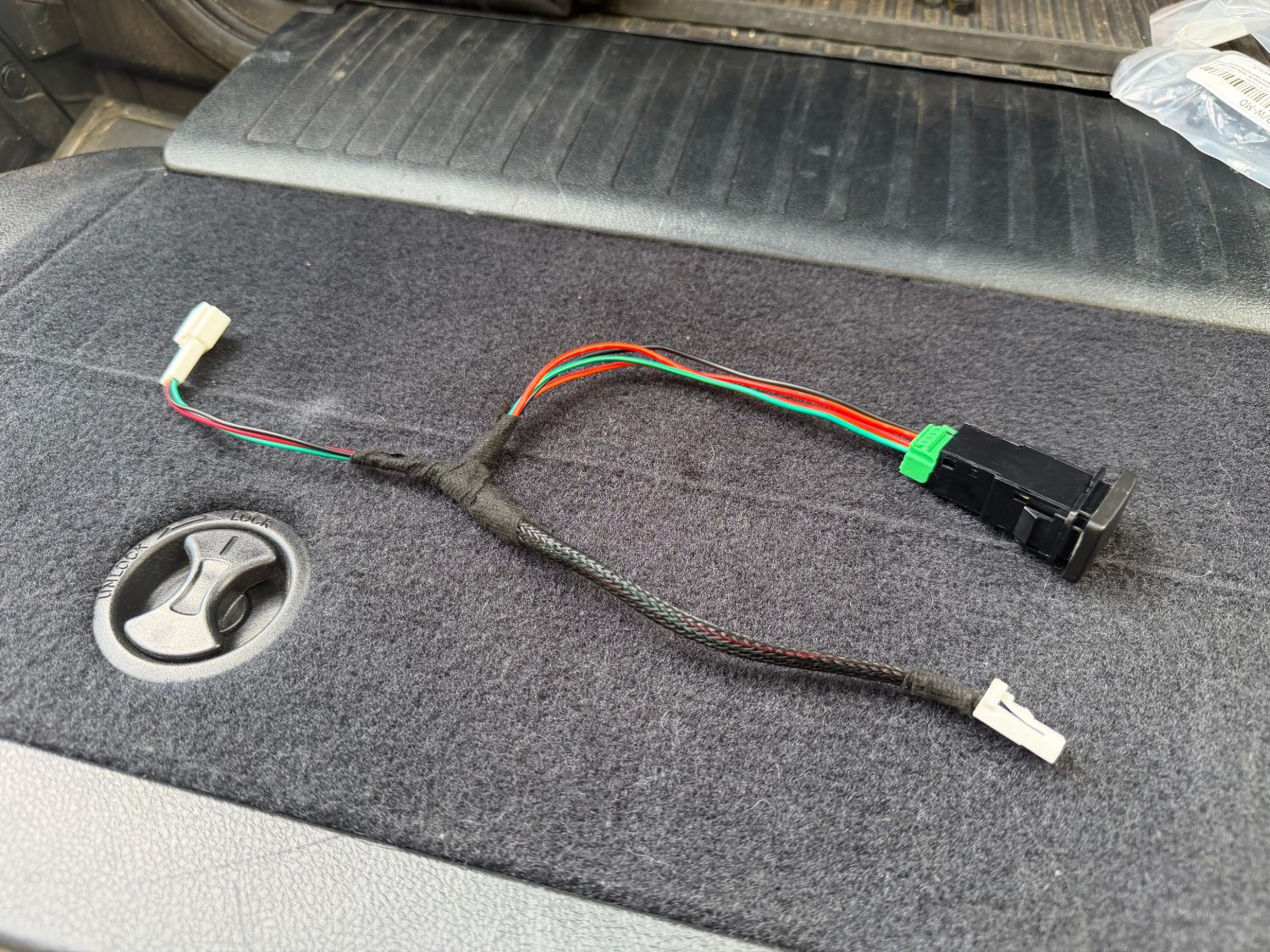 Plug-and-play hatch lock harness with momentary switch for the 200 Series rear hatch cargo light and opener